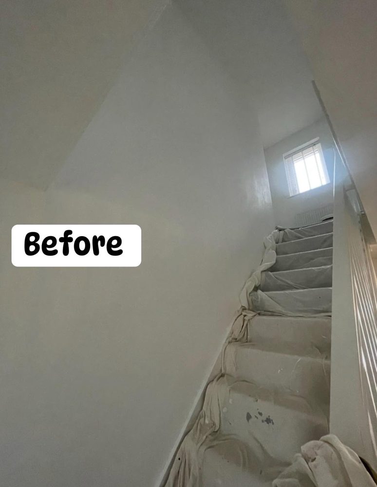 Hallway and stairs before: plain white walls with dust sheets on the stairs